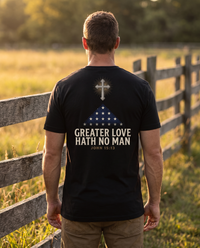 Man seen from behind wearing the tee: radiant cross above a folded memorial flag over GREATER LOVE HATH NO MAN, John 15:13 &mdash; view 1