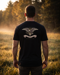 Man seen from behind wearing the E Pluribus Unum shirt: engraved eagle gripping a striped shield, olive branch, banner &mdash; view 1