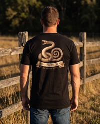 Man seen from behind wearing the Don't Tread on Me shirt: engraved coiled rattlesnake over a banner, Gadsden 1775 &mdash; view 1
